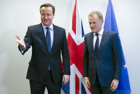 British Prime Minister David Cameron (L) and European Council President Donald Tusk attend a bilateral meeting ahead of a European Union leaders summit addressing the talks about the so-called Brexit and the migrants crisis, in Brussels, Belgium, February 18, 2016. REUTERS/Yves Herman