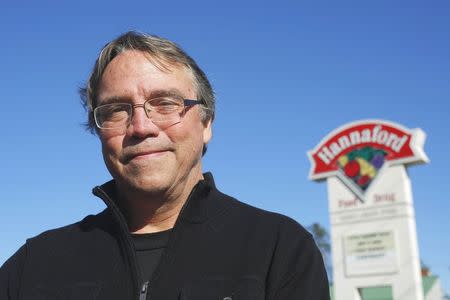 Ken Koehler, a business consultant who was stricken by an antibiotic-resistant strain of salmonella, stands in front of a grocery store where he buys his meat in Saco, Maine November 3, 2014. REUTERS/Brian Snyder