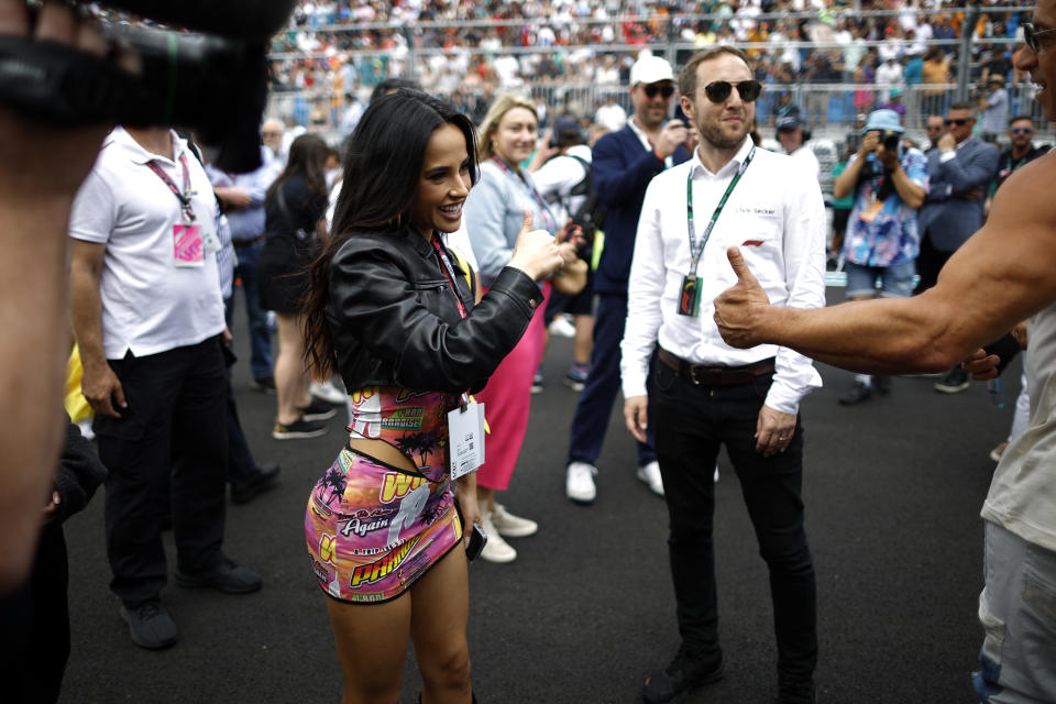 MIAMI, FLORIDA - MAY 07: Becky G interacts with Vin Diesel on the grid prior to the F1 Grand Prix of Miami at Miami International Autodrome on May 07, 2023 in Miami, Florida. (Photo by Chris Graythen/Getty Images)