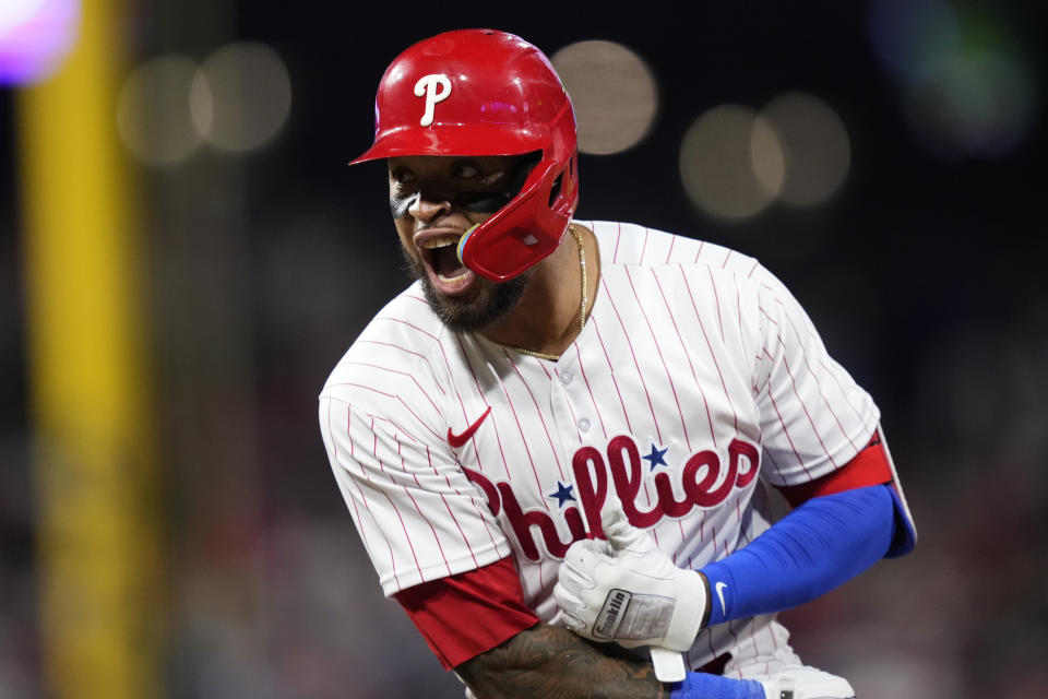 Philadelphia Phillies' Edmundo Sosa reacts after hitting a run-scoring single against Colorado Rockies relief pitcher Brad Hand during the eighth inning of a baseball game, Friday, April 21, 2023, in Philadelphia. (AP Photo/Matt Slocum)