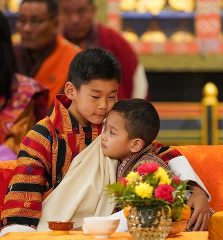 <p>Queen Jetsun Pema/Instagram</p> Prince Gyalsey Jigme Namgyel and Prince Jigme Ugyen at their sister Sonam Yangden’s naming ceremony on Dec. 9.