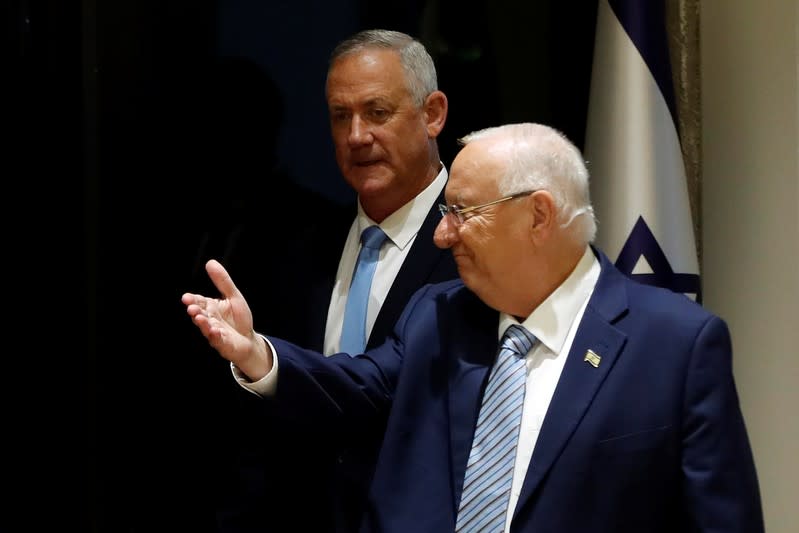 Israeli President Reuven Rivlin and Benny Gantz, leader of Blue and White party, arrive at a nomination ceremony at the President's residency in Jerusalem