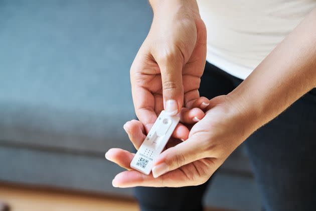 Many people are turning to at-home rapid tests to check if they have a breakthrough or regular case of COVID-19. Here's what experts want you to know about their accuracy and when you should use them. (Photo: Hache via Getty Images)