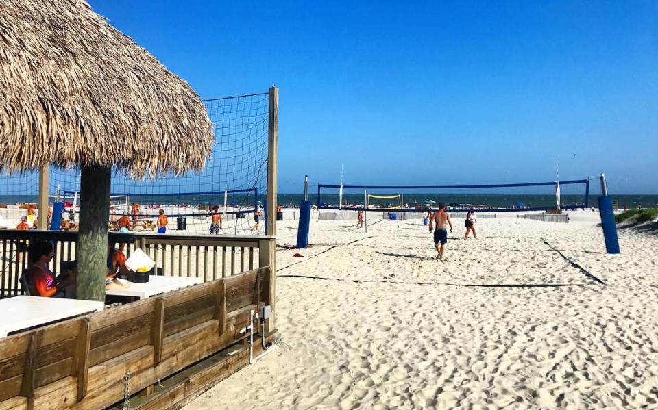 The thatched roof Tiki Hut overlooks the volleyball courts on Hilton Head’s busy Coligny Beach.