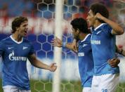 Zenit St. Petersburg's Hulk (C), Cristian Ansaldi (L) and Axel Witsel celebrate a goal against Atletico Madrid during their Champions League Group G soccer match at Vicente Calderon stadium in Madrid September 18, 2013. REUTERS/Sergio Perez (SPAIN - Tags: SPORT SOCCER)