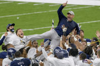 Georgia Southern coach Chad Lunsford and players celebrate the team's victory over Louisiana Tech in the New Orleans Bowl NCAA college football game in New Orleans, Wednesday, Dec. 23, 2020. (AP Photo/Matthew Hinton)