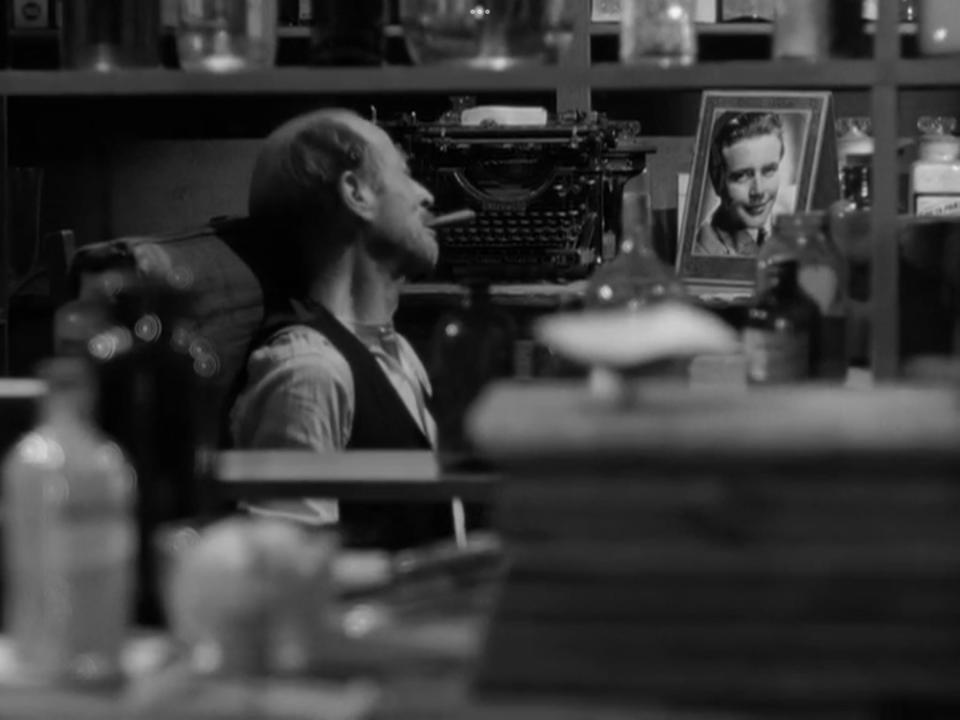 Mr. Gower (H.B. Warner) looks at a photo of his dead son, Robert, portrayed by Glen Vernon, in a scene from Frank Capra's "It's a Wonderful Life." Vernon is a Fall River native.