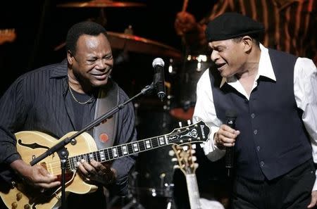 FILE PHOTO - U.S. musicians George Benson (L) and Al Jarreau perform on stage at the Vienna State Opera House as part of the annual Vienna Jazz Festival July 5, 2007. REUTERS/Herwig Prammer