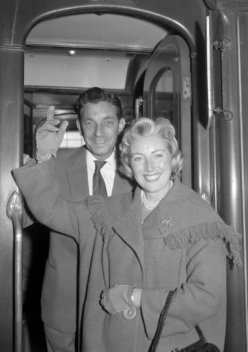 Singer Vera Lynn leaving with her husband, Harry Lewis, on a boat train from Waterloo Station, London.  (Photo by PA/PA Images via Getty Images)