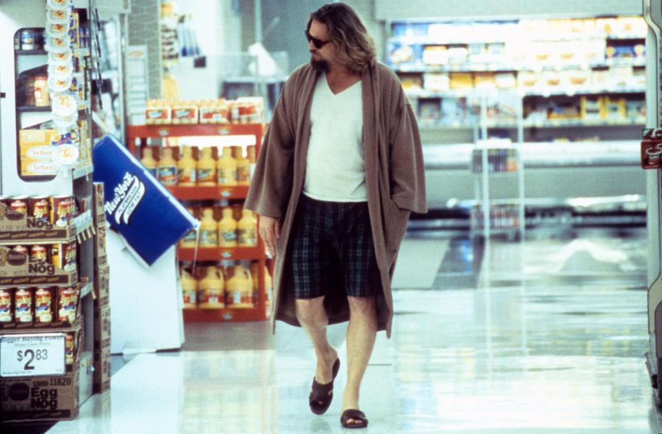 Jeff Bridges as The Dude, walking through a supermarket