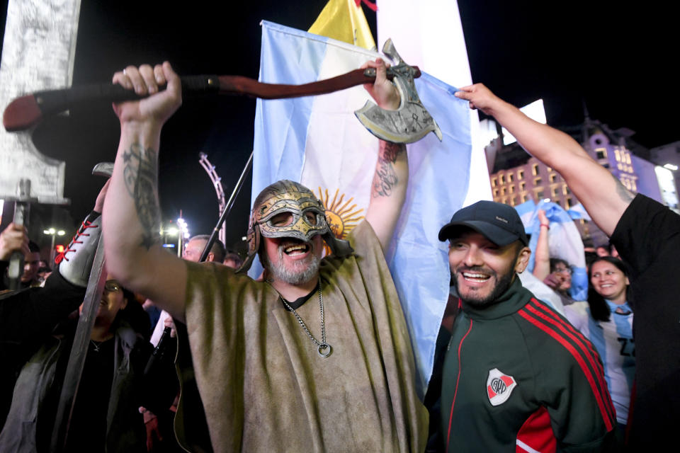 Supporters of Javier Milei, candidate of the Liberty Advances coalition, celebrate his victory over Sergio Massa, the Economy Minister and candidate of the Peronist party, in the presidential runoff election in Buenos Aires, Argentina, Sunday, Nov. 19, 2023. (AP Photo/Gustavo Garello)