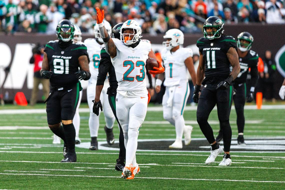 Miami Dolphins running back Jeff Wilson Jr. (23) reacts after running for a first down during second quarter of an NFL football game against the New York Jets at MetLife Stadium on Friday, Nov. 24, 2023 in East Rutherford, New Jersey.