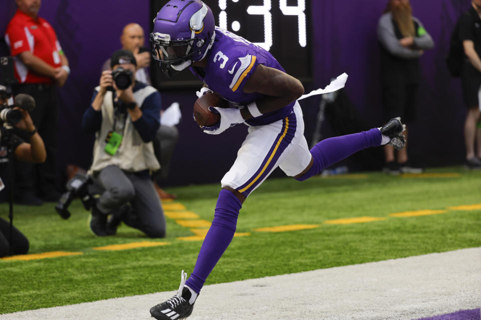 Minnesota Vikings wide receiver Jordan Addison catches a 5-yard touchdown pass during the first half of an NFL football game against the Kansas City Chiefs, Sunday, Oct. 8, 2023, in Minneapolis. (AP Photo/Bruce Kluckhohn)