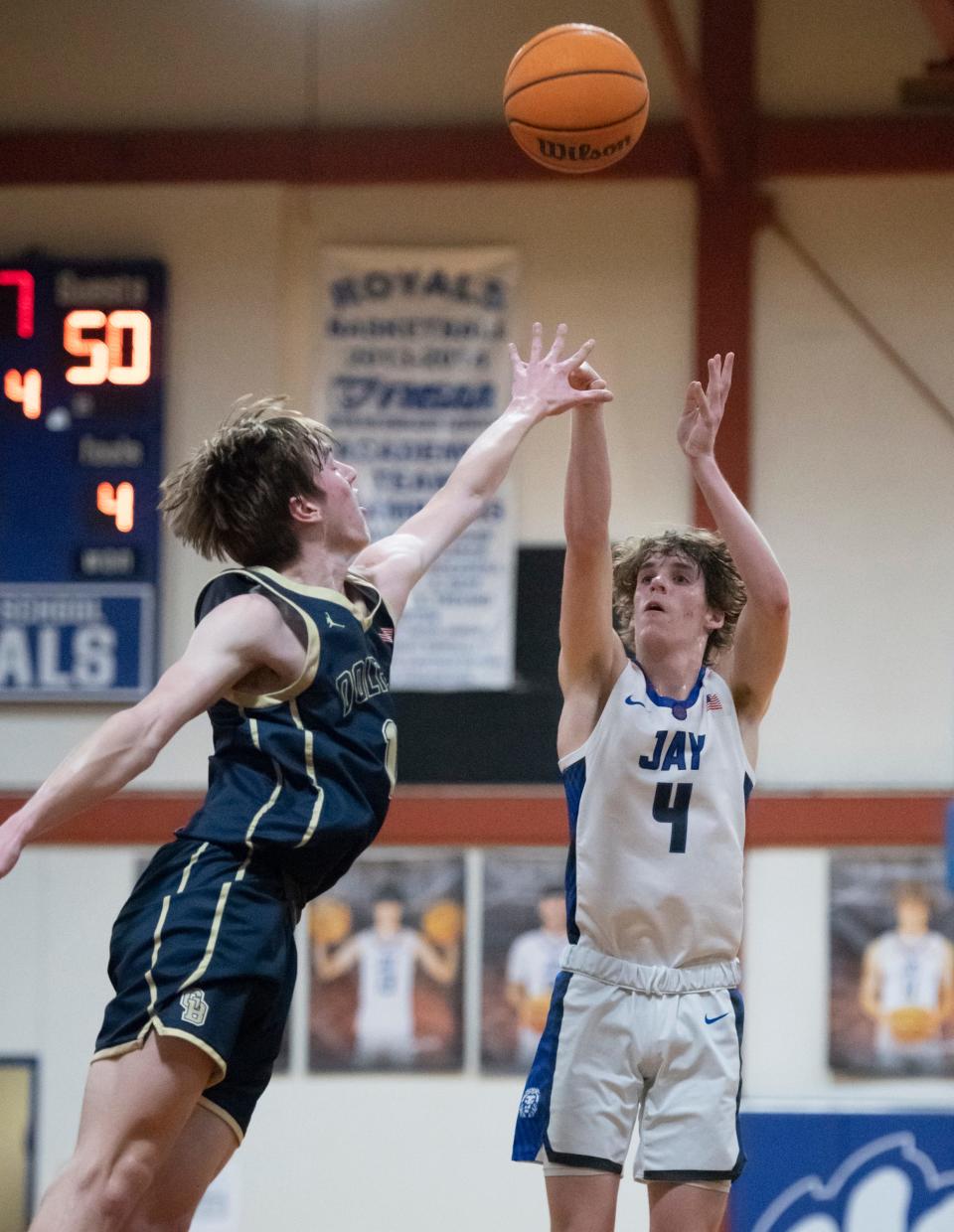 Ethan McDonald (4) shoots during the Gulf Breeze vs Jay boys basketball game at Jay High School on Tuesday, Jan. 18, 2022.