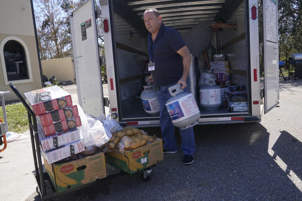 Mitchell Gottlieb arrives with supplies from Miami Beach for Chabad Lubavitch, Monday, Oct. 3, 2022, in Fort Myers, Fla. The synagogue has received supplies from all over Florida to help its members and neighbors. (AP Photo/Marta Lavandier)