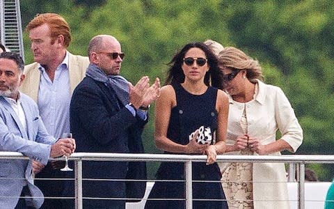 Mark Dyer (left) with Meghan Markle at the polo - Credit: David Hartley