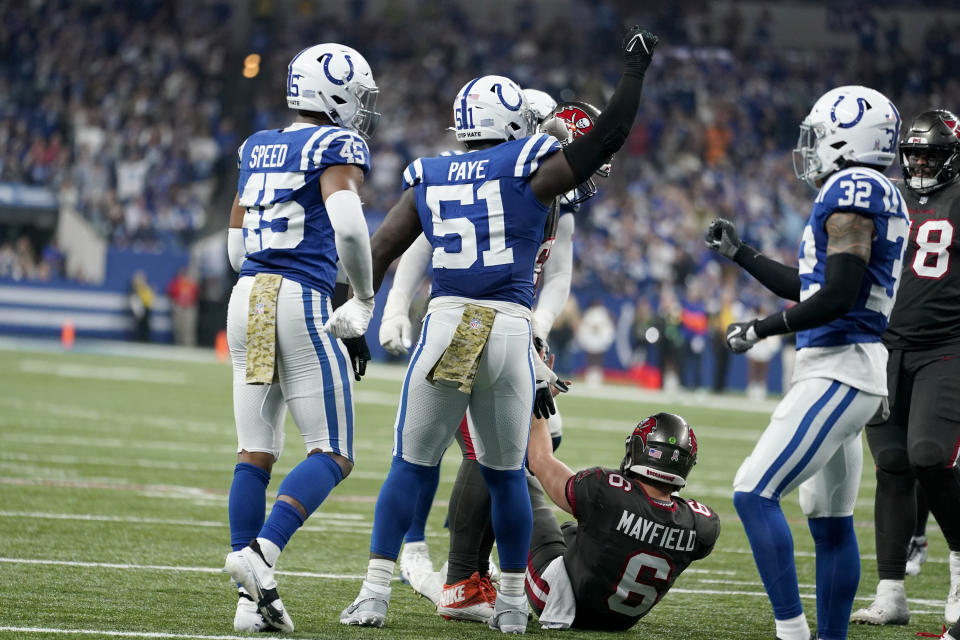 Indianapolis Colts defensive end Dayo Odeyingbo (54) celebrates with teammates after a sack on Tampa Bay Buccaneers quarterback Baker Mayfield (6) during the second half of an NFL football game Sunday, Nov. 26, 2023, in Indianapolis. (AP Photo/Michael Conroy)