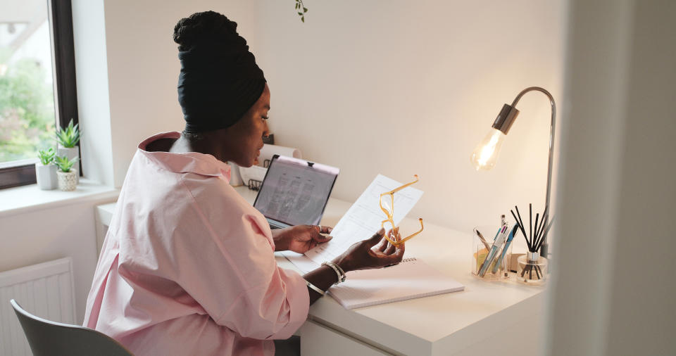 A healthcare worker looking at paperwork