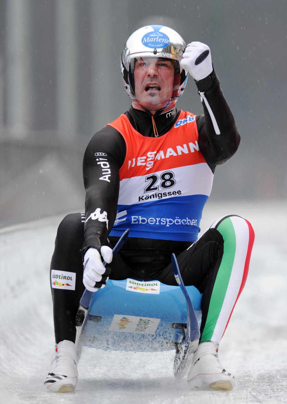 Armin Zoggeler from Italy celebrates after finishing second at the men's Luge World Cup in Koenigssee, Germany, Sunday, Jan. 5, 2014. (AP Photo/dpa,Tobias Hase)