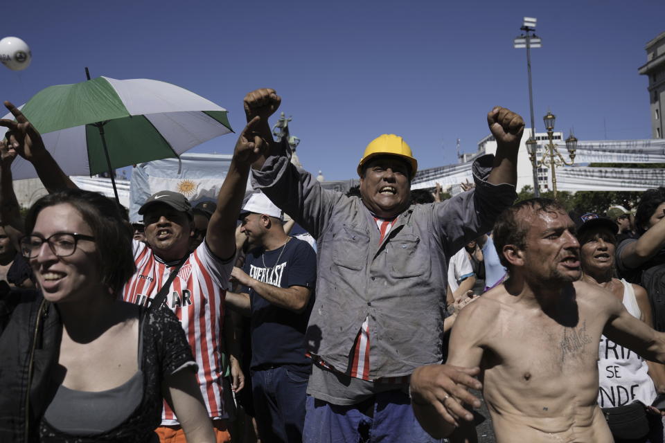 People rally outside Congress during a national strike against the economic and labor reforms proposed by Argentine President Javier Milei's government in Buenos Aires, Argentina, Wednesday, Jan. 24, 2024. (AP Photo/Rodrigo Abd)