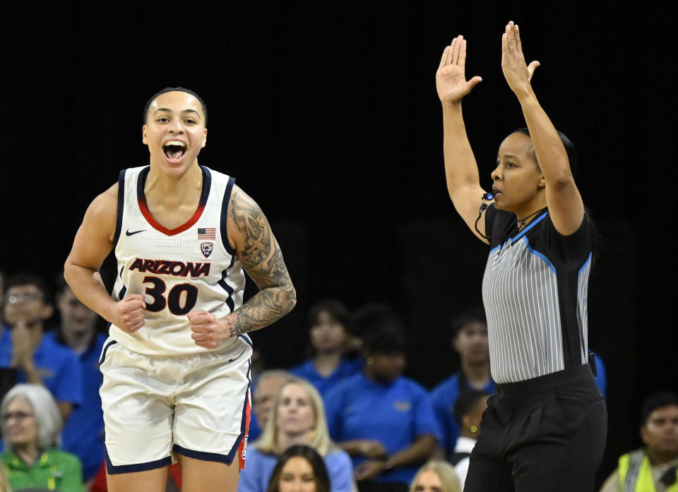 Arizona guard Jade Loville (30) reacts after a three-point basket during the first half of an NCAA college basketball game against the UCLA in the quarterfinal round of the Pac-12 women's tournament Thursday, March 2, 2023, in Las Vegas. (AP Photo/David Becker)