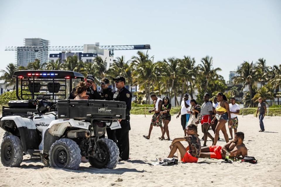 Miami Beach Police interact with spring breakers in March 2019.