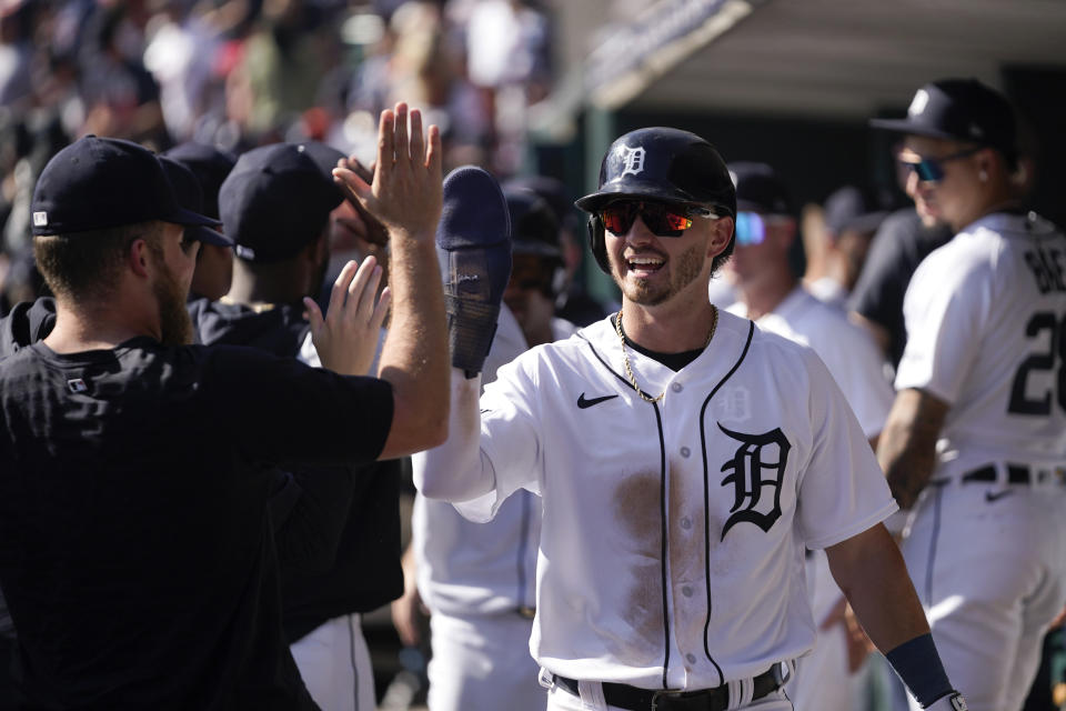 Detroit Tigers' Zach McKinstry celebrates scoring against the Cleveland Guardians in the sixth inning of a baseball game, Saturday, Sept. 30, 2023, in Detroit. (AP Photo/Paul Sancya)