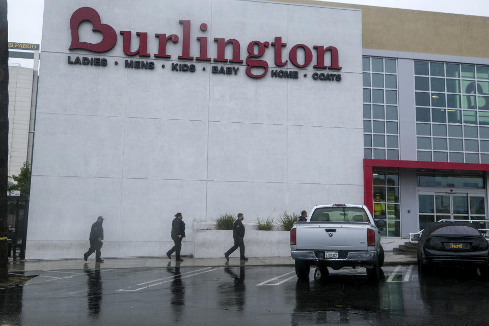 FILE - Police officers arrive the scene where two people were struck by gunfire in a shooting at a Burlington store, part of a chain formerly known as Burlington Coat Factory in the North Hollywood section of Los Angeles, Thursday, Dec. 23, 2021. The California Attorney General declined to file criminal charges against a Los Angeles police officer who fired a rifle at a suspect inside a clothing store in 2021, killing a 14-year-old girl in a dressing room, authorities said Wednesday, April 17, 2024. (AP Photo/Ringo H.W. Chiu,File)