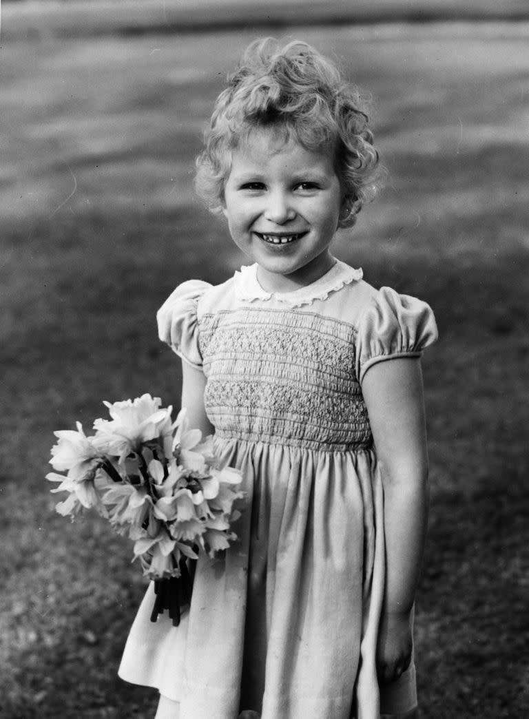 <p>A young Princess Anne is seen here with a bouquet of flowers. Clearly, royal fashions haven't changed much in the past 60 years. This smocked dress looks almost identical to the ones Princess Charlotte was seen wearing on the <a href="https://www.townandcountrymag.com/society/tradition/g10295873/kate-william-royal-family-tour-germany-poland-2017/" rel="nofollow noopener" target="_blank" data-ylk="slk:Royal Tour of Poland and Germany;elm:context_link;itc:0;sec:content-canvas" class="link ">Royal Tour of Poland and Germany</a>. </p>