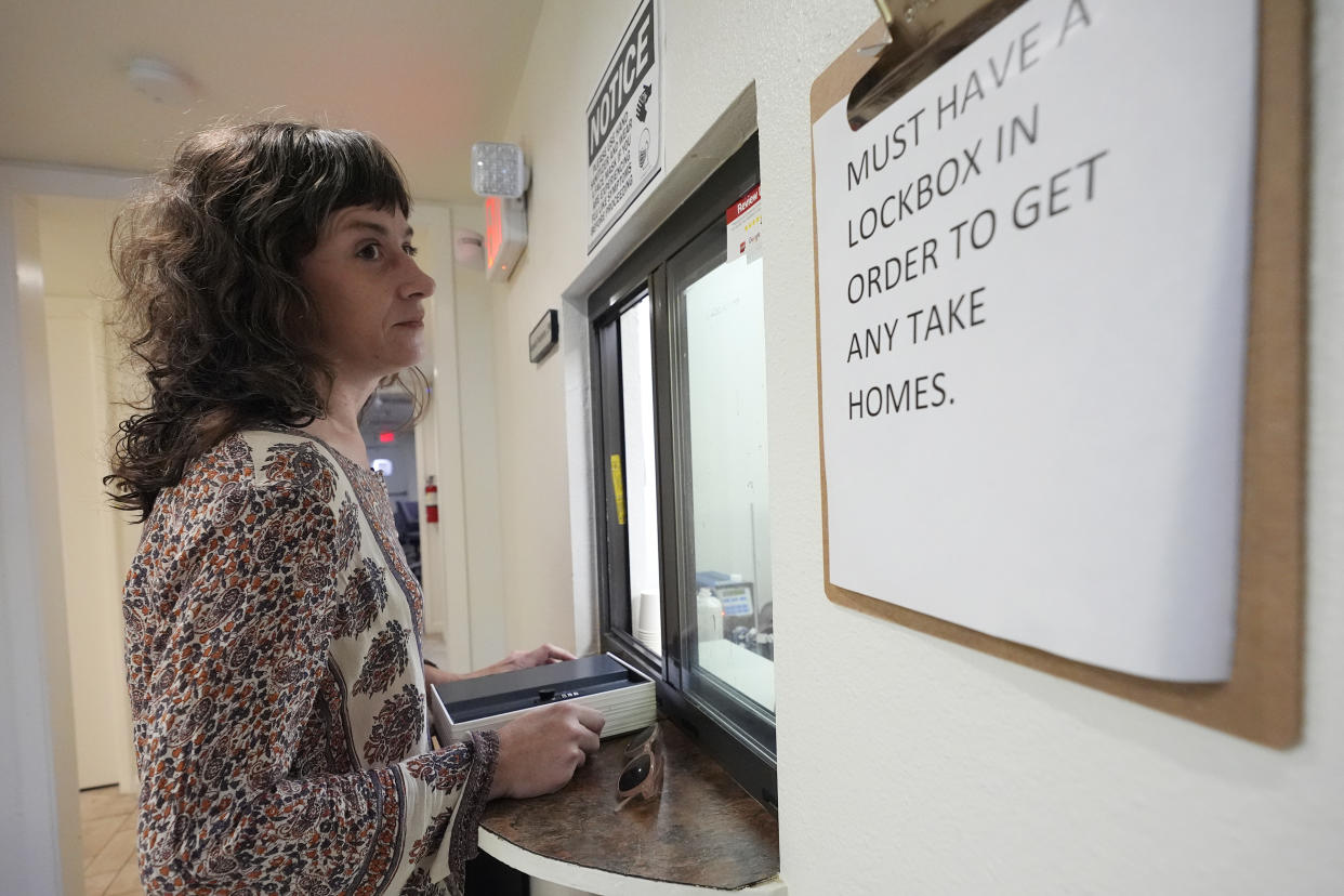 Methadone patient Irene Garnett, 44, of Phoenix, waits for her medication at a clinic in Scottsdale, Ariz., on Monday, Aug. 26, 2024. (AP Photo/Ross D. Franklin)