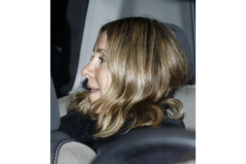 Carole Ghosn, the wife of former Nissan Chairman Carlos Ghosn, sits in a car as she arrives at his home in Beirut, Lebanon, Tuesday, Jan. 7, 2020. Japan sought the arrest of Carole Ghosn on suspicion of perjury related to statements she made at a Tokyo court last year related to her husband's case. Ghosn skipped bail late last year while awaiting trial in Japan and is now in Lebanon. (Meika Fujio/Kyodo News via AP)