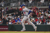 Los Angeles Dodgers' Freddie Freeman (5) gestures as he runs the bases after hitting a three-run home run against his former team, the Atlanta Braves, in the fifth inning of a baseball game, Monday, May 22, 2023, in Atlanta. (AP Photo/John Bazemore)