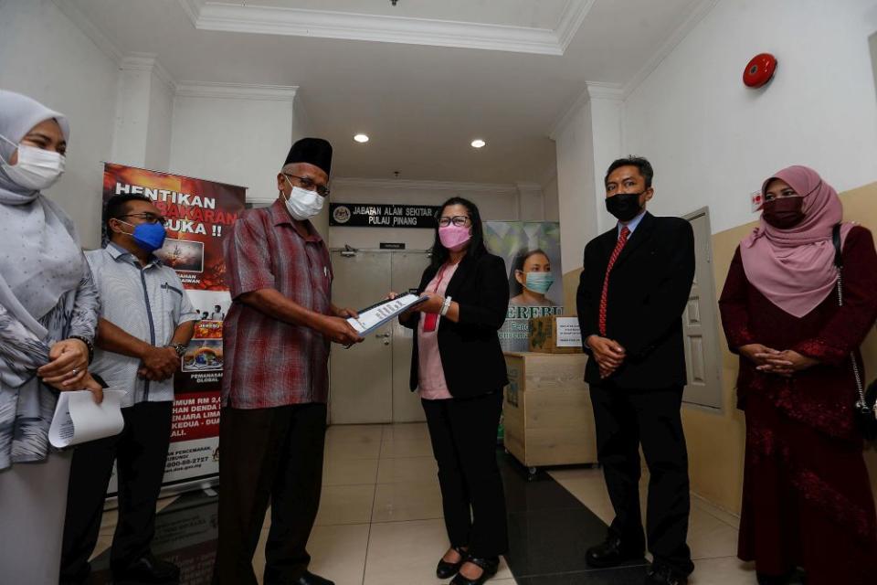 Datuk Yusoff Mohd Noor (third from left) submits objections to a reclamation project in Seberang Perai to Penang Department of Environment director Sharifah Zakiah Syed Sahab in Kepala Batas October 27, 2021. — Picture by Sayuti Zainudin