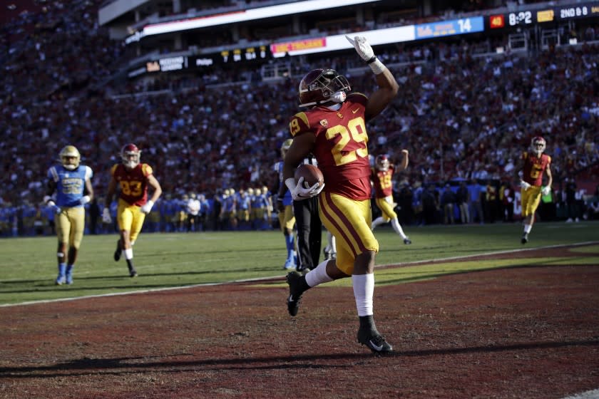 Southern California running back Vavae Malepeai (29) celebrates as he scores a touchdown against UCLA during the second half of an NCAA college football game, Saturday, Nov. 23, 2019, in Los Angeles. (AP Photo/Marcio Jose Sanchez)