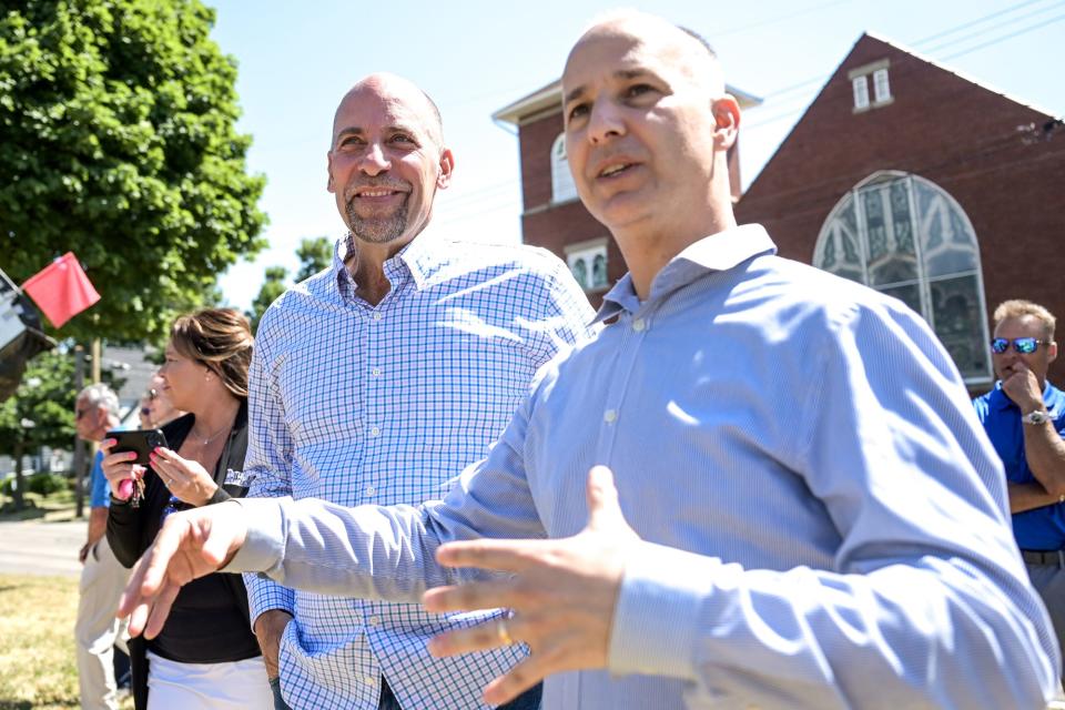 MLB Hall of Famer and Lansing native John Smoltz, left, talks with Mayor Andy Schor during a groundbreaking ceremony for the John Smoltz Strikeout Baseball Stadium on Tuesday, June 28, 2022, at Ferris Park in Lansing.