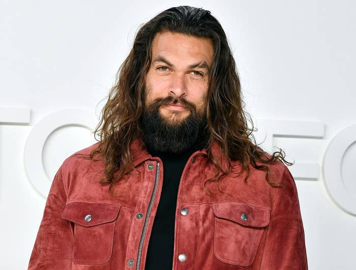 Jason wears a red suede jacket to an event