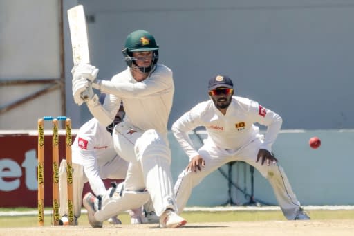 Zimbabwe captain Sean Williams reverse sweeps on his way to 39