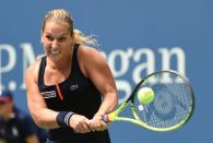 Dominika Cibulkova returns a shot against Ana Ivanovic during their US Open match on August 31, 2015 in New York