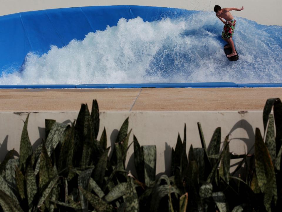 A man surfs in a wave pool on Sentosa Island in 2011.