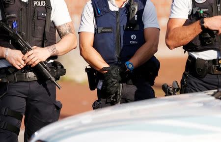 Belgian police officers secure the entrance of the main police station after a machete-wielding man injured two female police officers before being shot in Charleroi, Belgium, August 6, 2016. REUTERS/Francois Lenoir