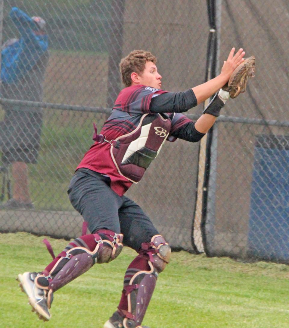 Union City catcher Tyler Wagley dives for a pop fly foul ball versus Hudson