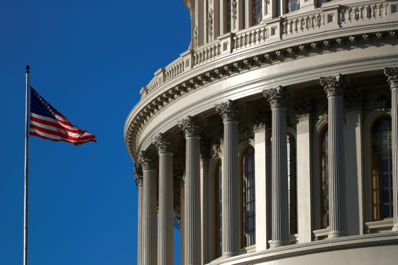 A U.S. flag flies outside of the Capitol dome ahead of the House of Representatives resolution appointing managers for Trump impeachment trial