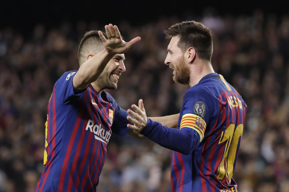 Barcelona's Lionel Messi celebrates with Barcelona's Jordi Alba after scoring his side's third goal during the Champions League semifinal, first leg, soccer match between FC Barcelona and Liverpool at the Camp Nou stadium in Barcelona, Spain, Wednesday, May 1, 2019. (AP Photo/Emilio Morenatti)