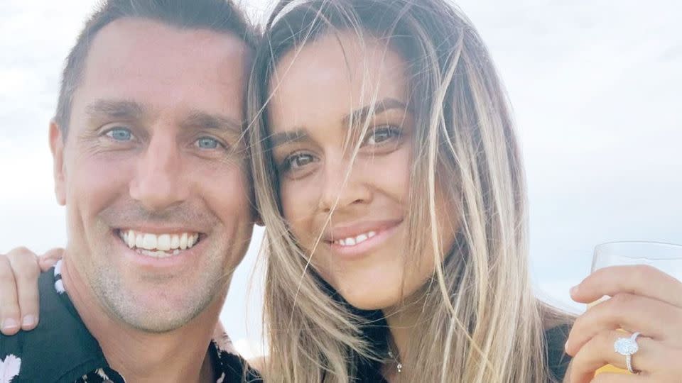 Mitchell Pearce and fiancee Kristen Scott pose together for a photo before the scandal broke.