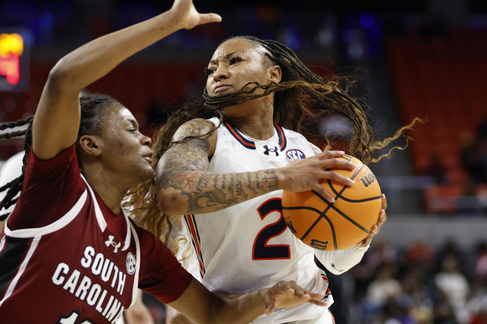 South Carolina guard MiLaysia Fulwiley, left, cuts off Auburn guard JaMya Mingo-Young (2) as she goes to the basket during the second half of an NCAA college basketball game, Thursday, Feb. 1, 2024, in Auburn, Ala. (AP Photo/ Butch Dill)