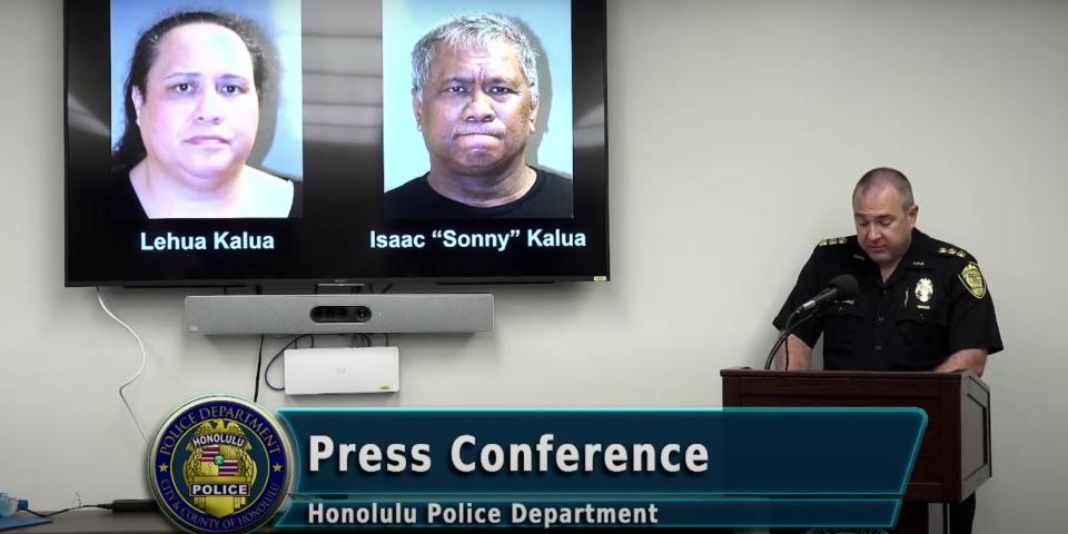 A screenshot of a Honolulu Police Department press conference, showing interim police chief Rade Vadic at the podium and mugshots of suspects Isaac and Lehua Kalua on a screen to his right.