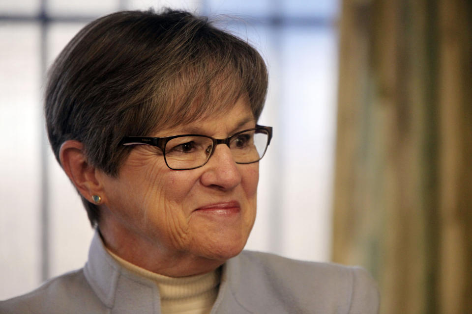 FILE - Kansas Gov. Laura Kelly pauses while answering questions from reporters during an event at a women's shelter, Jan. 23, 2023, in Topeka, Kan. The Democratic governor has vetoed a Republican transgender bathroom bill and a GOP plan for ending gender-affirming care for trans youth. (AP Photo/John Hanna)