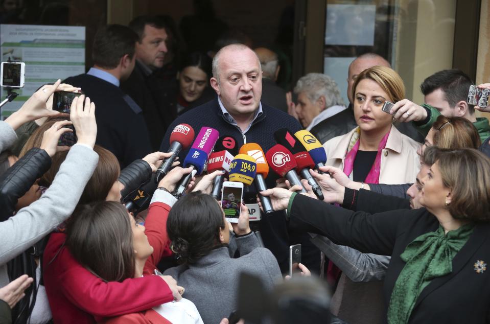 Georgian President Giorgi Margvelashvili speaks to journalists after voting at a polling station during presidential election in in Tbilisi, Georgia, Sunday, Oct. 28, 2018. Sunday's election will be the last time residents of the former Soviet republic of Georgia get to cast a ballot for president, that's if any of the 25 candidates gets an absolute majority. (Leli Blagonravova, Presidential Press Service Pool Photo via AP)