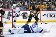 Tampa Bay Lightning goaltender Andrei Vasilevskiy (88) makes a save on a shot attempt by Pittsburgh Penguins' Danton Heinen (43) during the second period of an NHL hockey game in Pittsburgh, Tuesday, Oct. 26, 2021. (AP Photo/Gene J. Puskar)