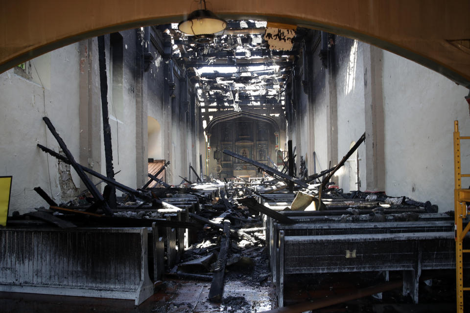 The interior of the San Gabriel Mission is damaged following a morning fire, Saturday, July 11, 2020, in San Gabriel, Calif. The fire destroyed the rooftop and most of the interior of the nearly 250-year-old California church that was undergoing renovation. (AP Photo/Marcio Jose Sanchez)